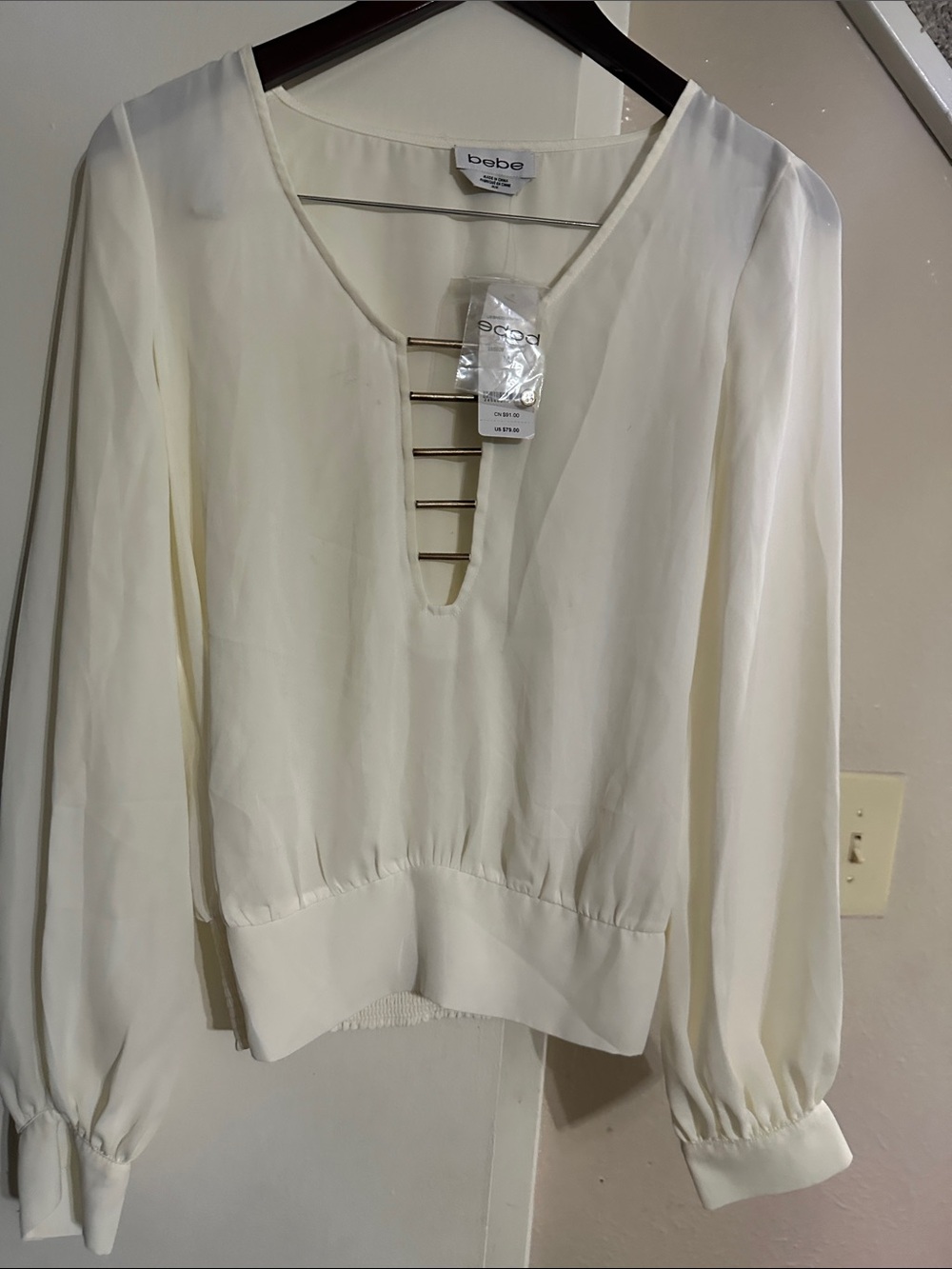 bebe Cream V-Neck Long Sleeve Blouse with Gold Bar Detail